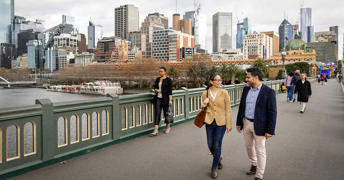 People walking through a city in the official KONE transaction-site photograph
